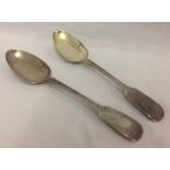 A pair of Victorian, Irish silver, fiddle design serving spoons with fish motif to handles.