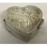 A 925 silver heart shaped pill/trinket box with hinged lid and engraved decoration.