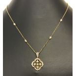 An Art Deco style 9ct gold necklace set with .25 ct of diamonds.