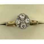 An 18ct gold and diamond Art Deco dress ring with 4 small diamonds set in platinum, total 0.28ct.