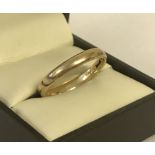 A 9ct gold wedding band. Size Q½. Hallmarks to inside of band.