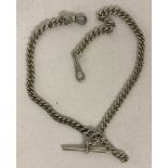 A heavy silver albert watch chain with two lobster clasps and a T bar. Approx. 46.4g.