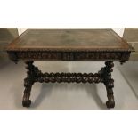 A Victorian 2 drawer, leather topped writing table raised on barley twist legs.