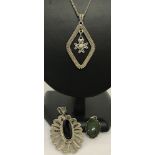 A silver diamond shaped filigree pendant with dangle cross on a 20" fine curb chain.