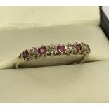 A 9ct gold diamond and ruby eternity ring.