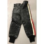 A pair of vintage "Night Riders Camptain Fashions" black leather motorcycle trousers.