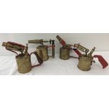 4 vintage brass blow lamps; handles and blower supports have been painted red.