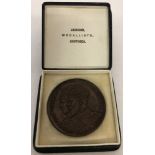 A bronzed medallion/coin to commemorate the coronation of King George V & Queen Mary 1911.