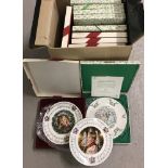 A collection of 12 boxed and unboxed Royal Doulton Christmas Carols and Christmas year plates.