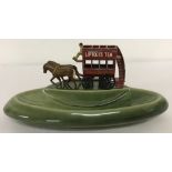 A circa 1960's Wade green ceramic pin tray mounted with Matchbox diecast vehicle.