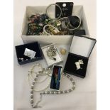 A quantity of boxed and unboxed vintage and modern costume jewellery.