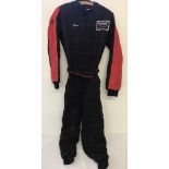 An RSS childs Go Kart all-in-one racing suit in black and red, with Tommy Motorsports Badge.