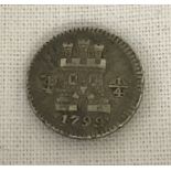 A Charles IV of Spain colonial 1/4 real coin for Bolivia dated 1799.