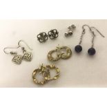 6 pairs of silver and white metal earrings; studs, hoops and drops.