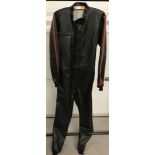 A vintage black and red all-in-one racing suit with zip front.