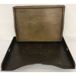 A vintage oak tea tray together with a dark wood bed tray.