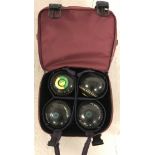 A set of 4 Almark Sterling lawn bowls in carry bag.