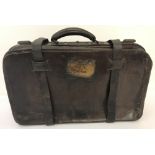A vintage leather gentleman's suitcase with original GER Railway label for Foulsham, Norfolk.