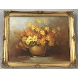 Robert Cox signed oil on canvas of flowers in a vase, in orange tones.