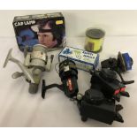 A small collection of assorted fishing equipment to include reels, optonic sensors and weight mould.