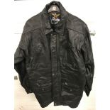A vintage men's black leather 3/4 length coat with zip & popper fastening and front pockets.