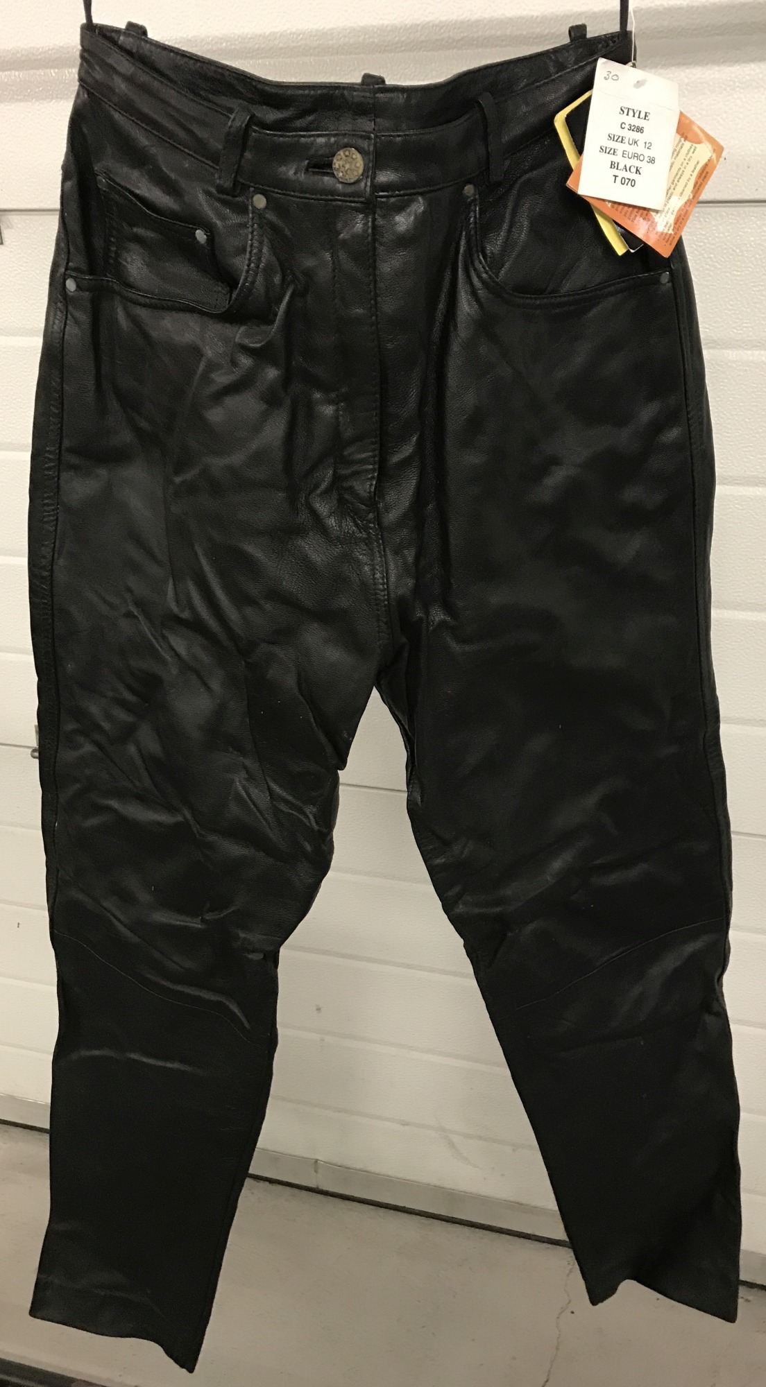 A pair of ladies "Modern Classics" black leather motor cycle trousers. With tags.