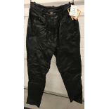 A pair of ladies "Modern Classics" black leather motor cycle trousers. With tags.