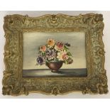 A small gilt framed oil on board of a posy bowl of flowers. Indistinct signature to bottom .