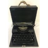 A cased Olympia Progress vintage typewriter.
