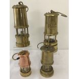 4 small vintage brass collectable miners lamps.