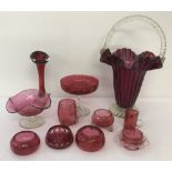 A quantity of assorted vintage Cranberry coloured glass items.