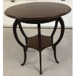 An Edwardian mahogany circular occasional table raised on 6 curved legs of bulbous form.