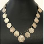 A antique necklace made from silver George V Emperor 2 annas silver coins and a silver George V 1/4