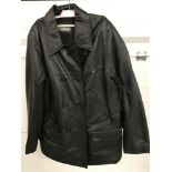 A vintage ladies black leather jacket with button fastening.