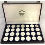 A cased 1976 Canadian Olympics silver proof coin set.