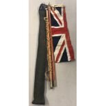 A vintage cased scouts flagpole together with leather carrying strap and 1yd Union Jack flag.