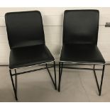 Pair of modern padded vinyl dining/kitchen chairs. Black & white with metal frames.