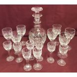 A Stuart crystal sherry decanter with 7 matching sherry glasses and 8 matching liqueur glasses.