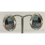A pair of Southwestern silver and natural stone large stud style earrings by Carolyn Pollock.