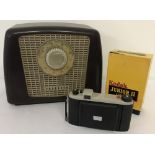 A vintage Ferguson Bakelite radio together with a boxed Kodak Junior II camera.