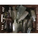 A crate of vintage glass bottles to include lea & Perrin's and Dinneford's Magnesia.