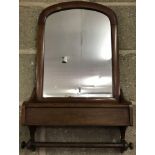A Victorian dark wood framed, curved top wall hanging mirror with towel rail and lidded box.