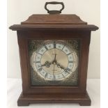 A modern Acctim mahogany cased quartz mantle clock with Westminster chime.
