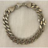 A heavy curb style chain bracelet.