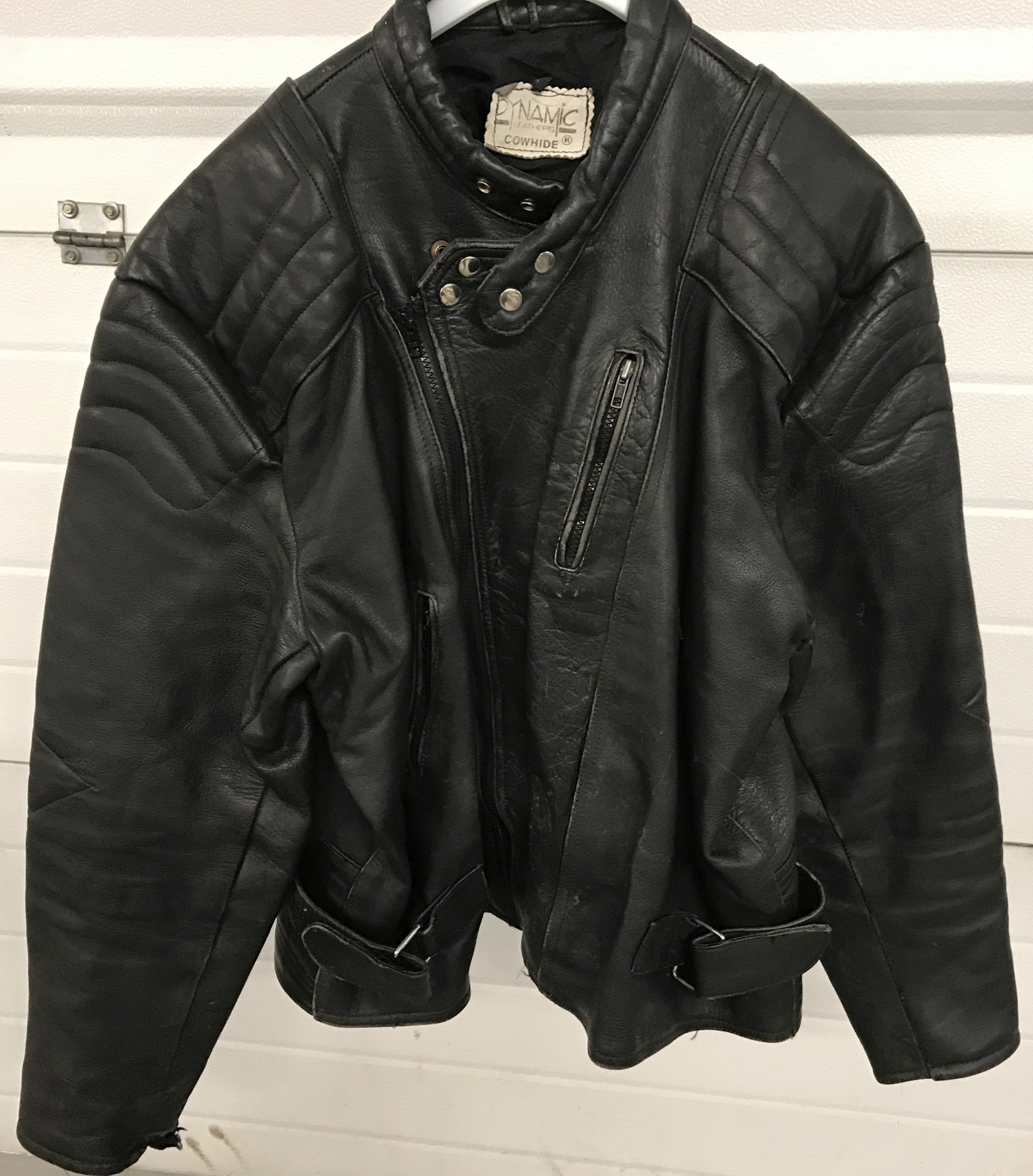A vintage black leather "Dynamic Leathers" bikers jacket.