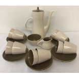 A vintage Poole Pottery ceramic coffee set in mushroom & sepia colourway.