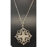 A large decorative pendant by Peruzzi on a 925 silver 24 inch box chain.
