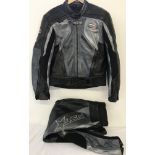 An RST genuine cowhide motorcycle jacket and matching trousers in black and silver.