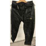 A pair of black leather ladies motorcycle trousers by "The Huson Leather Co".