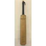 A vintage signed long handle Slazenger cricket bat. Auto graphed by players from the 1960's & 70's.